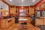 Fully equipped kitchen with gas range with four burners
